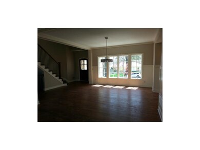 Front Entry, Dining Room & Staircase to 2nd Floor.