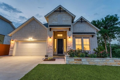 View of front facade featuring an attached garage