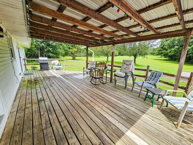 There is a covered back porch which is great to sit and watch the deer, rabbits, etc.