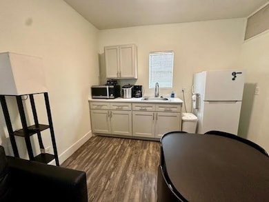 Kitchen featuring dark wood-style flooring, freest