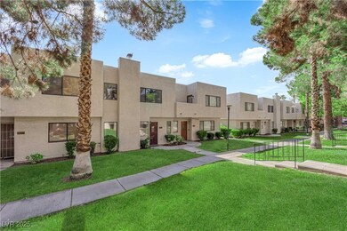 View of front facade with a front lawn, stucco sid