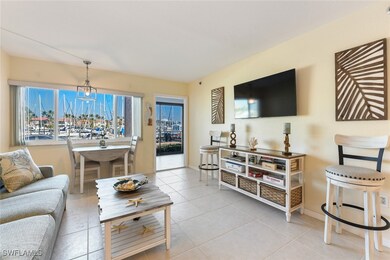 Living room featuring baseboards and tile patterne