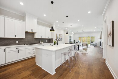 Kitchen include an impressive island that can doub