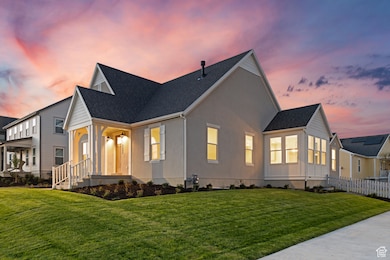View of front of house with roof with shingles and stucco siding