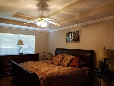 Remote master bedroom has tray ceiling and en suit