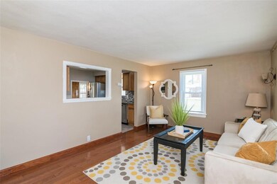 Beautiful oak hardwoord flooring illuminates this space with natural sunlight flowing into the kitchen.
