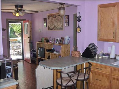 View of kitchen looking toward front door