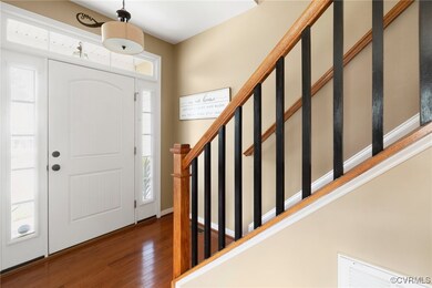 Entryway with hardwood / wood-style flooring and p