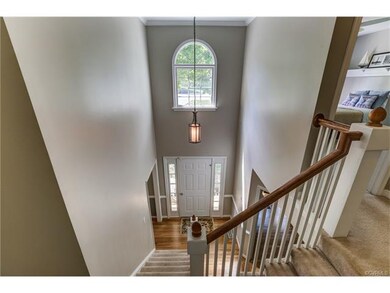This two story foyer opens to the hallway above.  