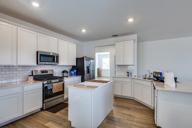 Kitchen with appliances with stainless steel finis