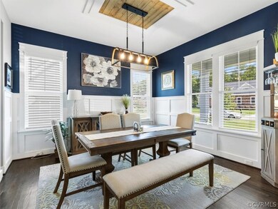 Off of the well appointed entry you’ll find the dining room w/ wainscotting and chandelier w/ decorative framing that is open to kitchen.