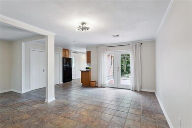 Den showing french doors leading to Secret Garden