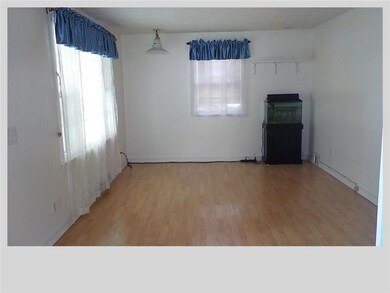 Spacious Family Room with Newer Laminate Wood Floo