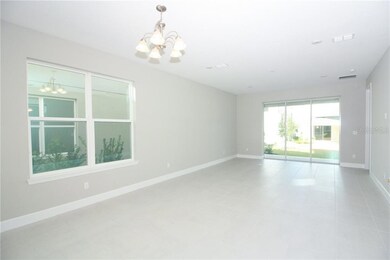 The large sliding glass doors at the Gathering area brings the outdoors in with views of your backyard oasis!