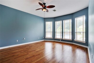 Spacious Master Bedroom has beautiful wood floors