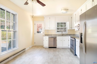 Kitchen walks out to side porch/driveway for easy 