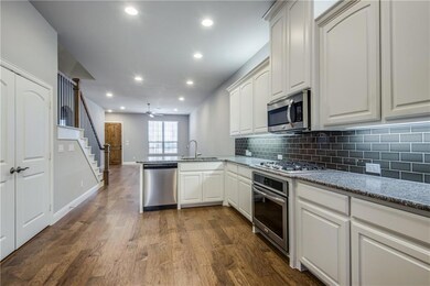 Spacious kitchen with lots of counter and cabinet 