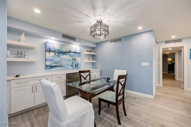 Dining area featuring recessed lighting, light wood-style floors, and a chandelier