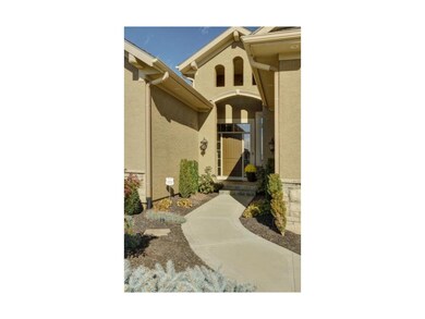 Beautifully landscaped entry with tile.