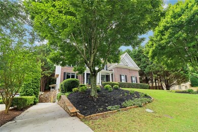Obstructed view of property with brick siding and a front lawn