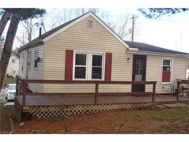 Back of home with deck for relaxing
