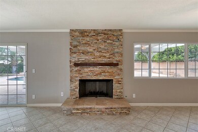 Beautifully Remodeled Fireplace with rustic wood mantel!