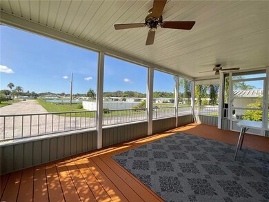 Screened in Front Porch with view of pond