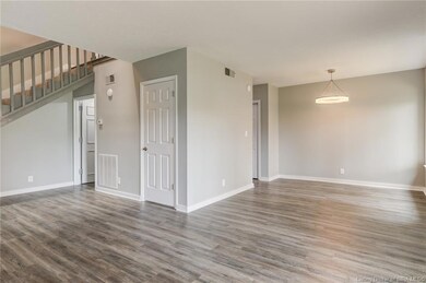 living, dining, door to half bath