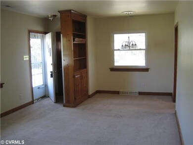 Living Room - with large bookcase, complementing wood trim
