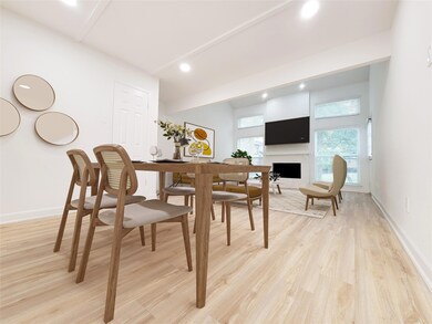 Dining room featuring a large fireplace and light 