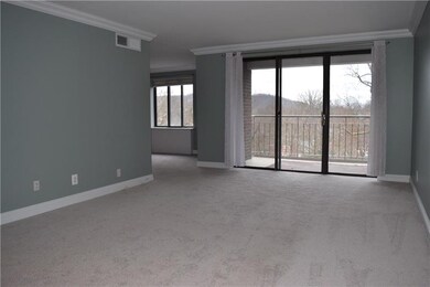The living room with finished ceilings, crown mold