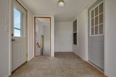 Entry/ Mudroom with entrance into basement.
