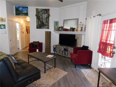 GAS FIREPLACE IS RIGHT BEHIND THE TV.    PATIO DOO