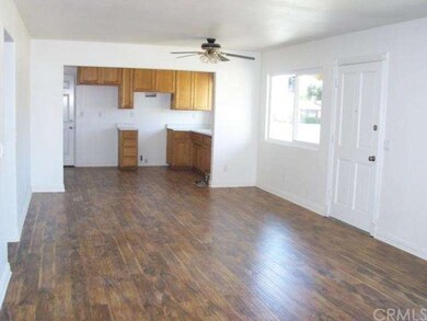 Living room to kitchen- new laminate flooring.