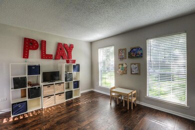 Spacious living room, currently being used as a playroom.  Entire home is painted in soothing NEUTRAL COLORS.