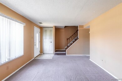 Living room view to the front door, the 3X2 coat c