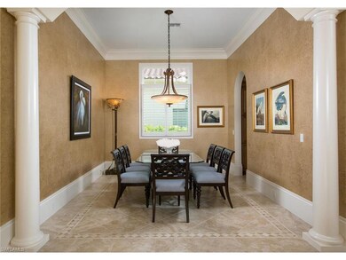 Large dining room with tile detail in the floor and Alabaster chandelier