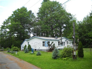 Front of house with garage in...