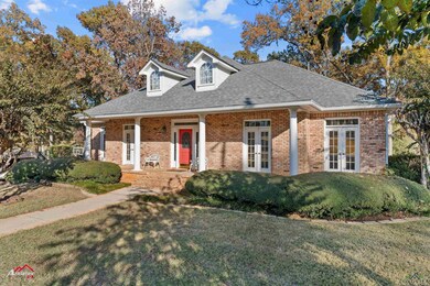 New england style home featuring french doors and 
