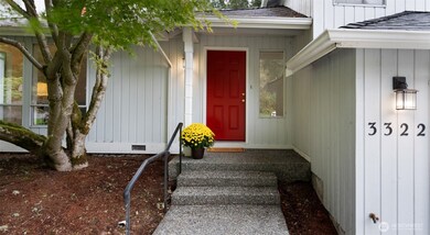 A classic red front door and aggregate steps create a welcoming first impression - charming, timeless, and ready to invite you in. Let’s step inside and take a look around!