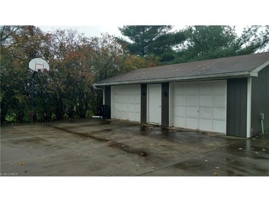 Two car oversized garage with openers.  The oversi