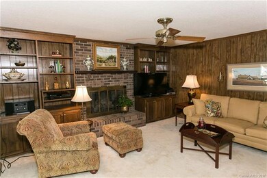 The warm, inviting family room is located just off