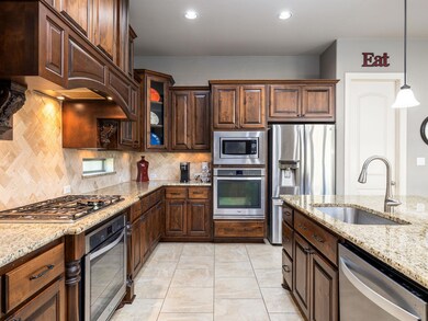 Kitchen with appliances with stainless steel fini