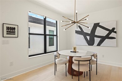Dining space with light hardwood / wood-style floo