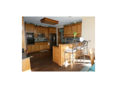 Kitchen view from Breakfast room showing the 3 bar