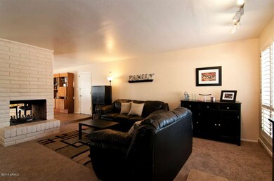 living room with two sided fire place