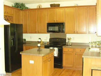 Kitchen. Another view of this lovely kitchen. Notice the Wood Flooring