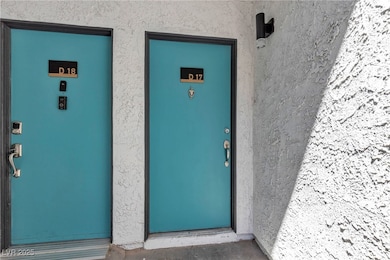Property entrance featuring stucco siding