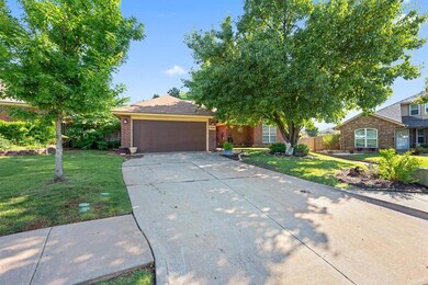 View of front of home featuring a garage and a fro