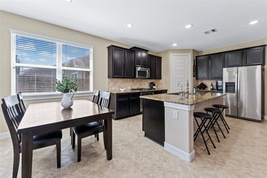 Lovely, open kitchen with stainless energy-star appliances. Room for counter-high stools and breakfast table.